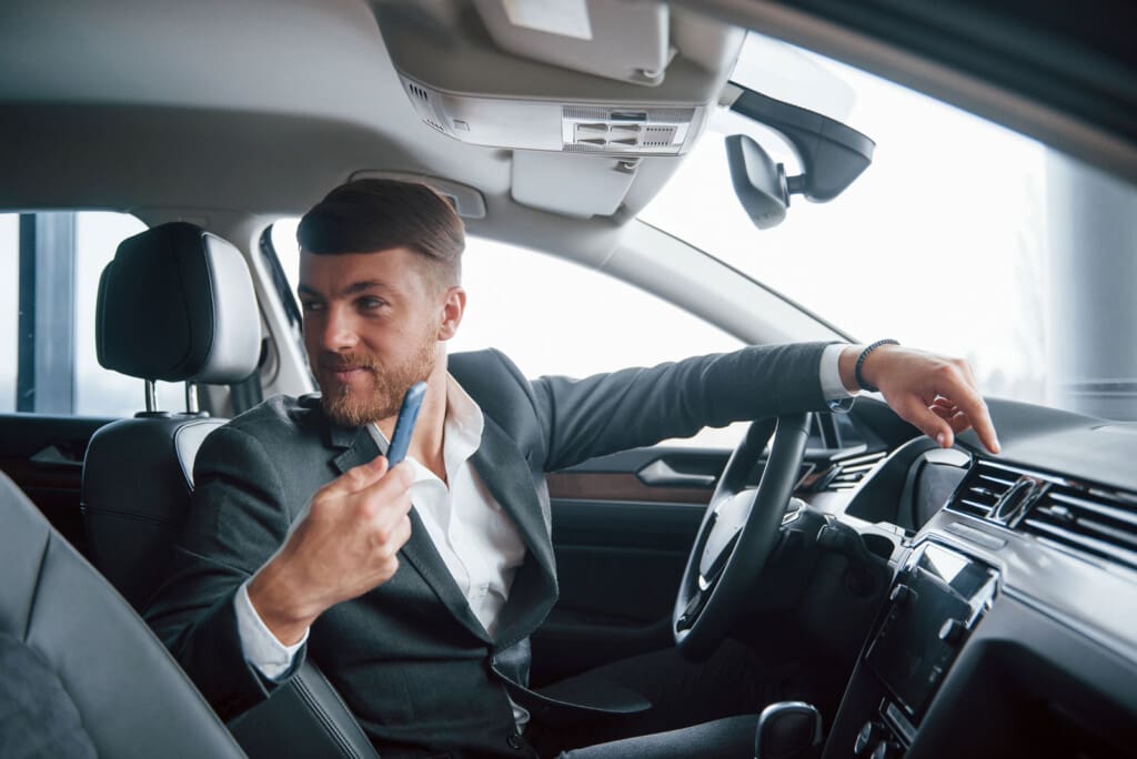 passenger back seat modern businessman trying his new car automobile salon