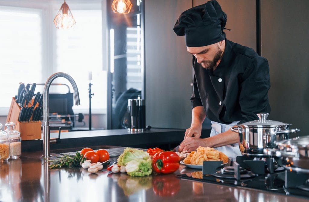 professional young chef cook in uniform working on 2023 11 27 05 16 58 utc Large 1024x672