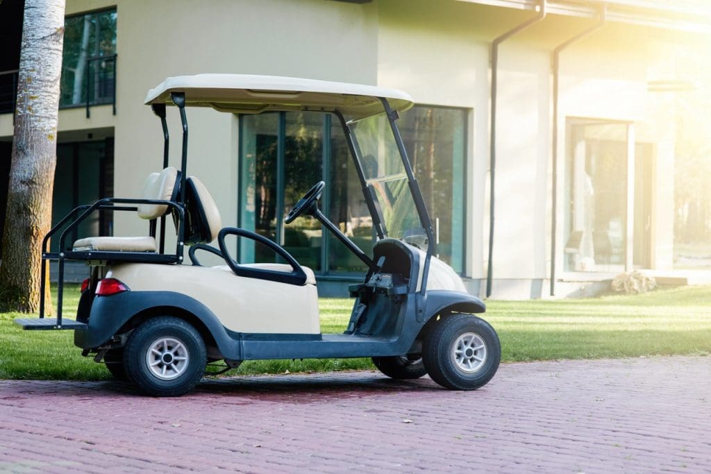 white golf cart is parked near the modern cottage 2023 11 27 05 18 44 utc Large 1024x683