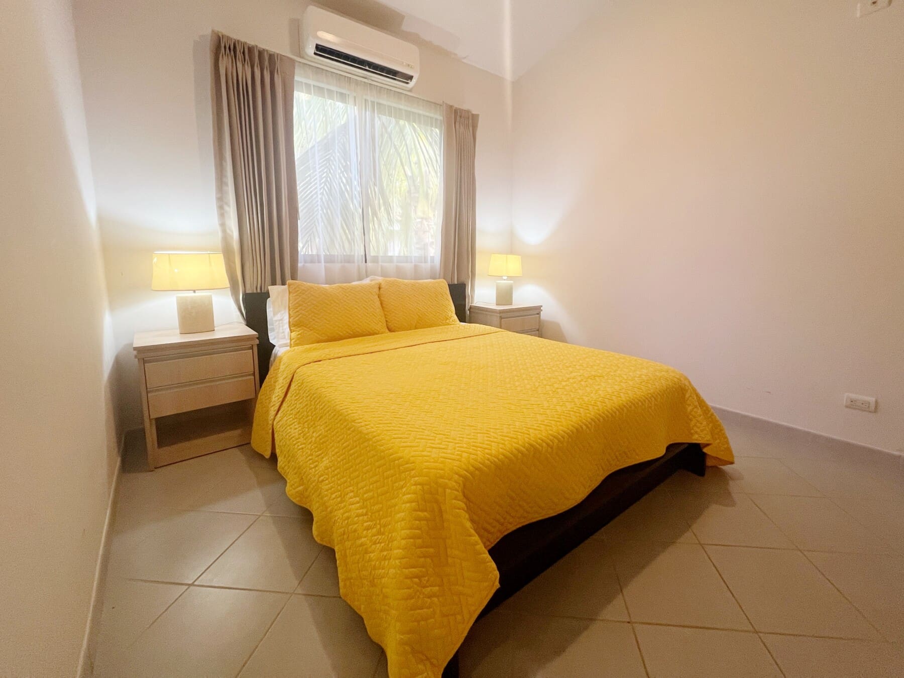 The second bedroom has a queen bed with lots of storage space.