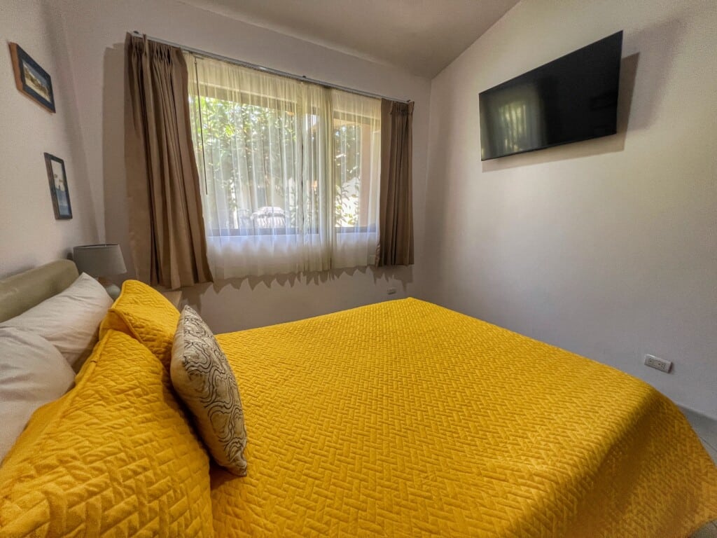 The primary bedroom has queen bed with ensuite bathroom, closet, Smart TV and safe.