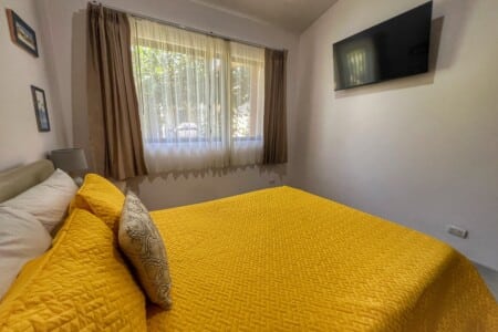 The primary bedroom has queen bed with ensuite bathroom, closet, Smart TV and safe.
